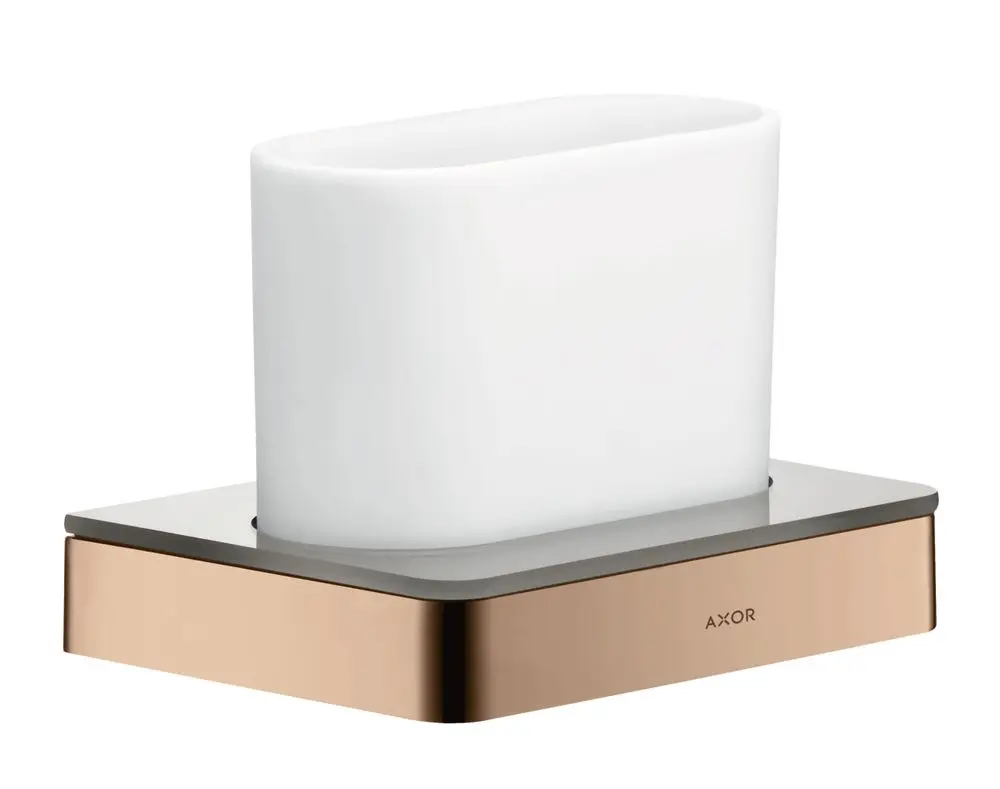Zahnputzbecher in Weiß mit metallischem Untergestell in Rotgold von AXOR. Rechteckige Form auf einem quadratischen, flachen Standfuß.